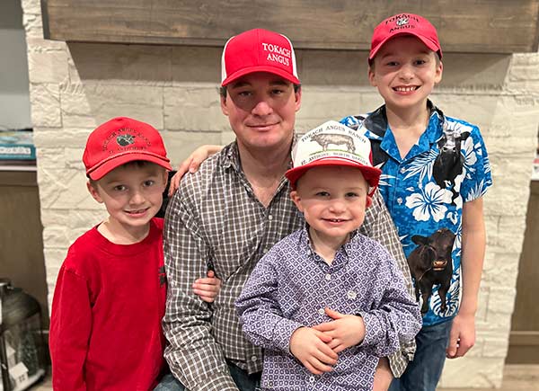 Ben Tokach with kids wearing historic hats